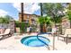 Relaxing community hot tub surrounded by palm trees and lounge seating at 1920 E Bell Rd # 1189, Phoenix, AZ 85022