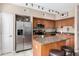 Modern kitchen features stainless steel appliances, hardwood cabinetry, and a functional island at 1920 E Bell Rd # 1189, Phoenix, AZ 85022