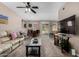 Inviting living room features plush seating, ceiling fan, modern coffee table, and seamless access to the outdoor balcony at 1920 E Bell Rd # 1189, Phoenix, AZ 85022