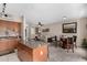 Open floorplan with kitchen, living, and dining areas, featuring hardwood cabinetry and modern decor at 1920 E Bell Rd # 1189, Phoenix, AZ 85022