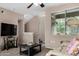 Cozy living room showcases a plush sofa, modern TV, and seamless transition to the staircase at 1920 E Bell Rd # 1189, Phoenix, AZ 85022