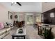 Inviting living area features plush seating, modern TV, bar seating, and access to the outdoor balcony at 1920 E Bell Rd # 1189, Phoenix, AZ 85022