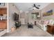 Open-concept living room boasts a comfortable sofa, TV, and seamless flow to the kitchen and staircase at 1920 E Bell Rd # 1189, Phoenix, AZ 85022