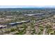 This aerial view highlights the proximity of homes to shopping, dining, and retail, with mountain views in the background at 19530 N 84Th Ave, Peoria, AZ 85382