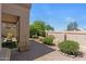 Landscaped backyard with gravel and desert foliage, as seen from covered patio at 19530 N 84Th Ave, Peoria, AZ 85382