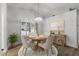 Dining room with hardwood floors, modern table, and natural light from the window at 19530 N 84Th Ave, Peoria, AZ 85382