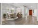 Bright dining area with hardwood floors, modern table, and natural light at 19530 N 84Th Ave, Peoria, AZ 85382