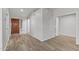Bright and neutral entryway with wood-look floors and views to other rooms at 19530 N 84Th Ave, Peoria, AZ 85382