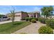 Beautiful exterior of home with desert landscaping, mature tree, and attached garage at 19530 N 84Th Ave, Peoria, AZ 85382