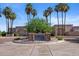 The Vistas Golf Course & Restaurant entrance, surrounded by lush landscaping and palm trees at 19530 N 84Th Ave, Peoria, AZ 85382