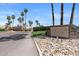 Sign for 'The Lakes' Golf Course & Restaurant with lush landscaping and desert accents at 19530 N 84Th Ave, Peoria, AZ 85382