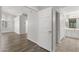 Hallway with wood-look floors connects main living space to bedroom and bath at 19530 N 84Th Ave, Peoria, AZ 85382