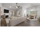 Open living area with a fireplace, dining table, and hardwood flooring at 19530 N 84Th Ave, Peoria, AZ 85382