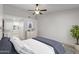 Neutral main bedroom features vaulted ceiling and views to the ensuite bath at 19530 N 84Th Ave, Peoria, AZ 85382