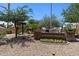 Reflection Garden sign surrounded by trees, colorful flowers and walking paths at 19530 N 84Th Ave, Peoria, AZ 85382