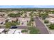 Charming neighborhood street view showcasing well-maintained homes with desert landscaping and tile roofs, under a clear blue sky at 19530 N 84Th Ave, Peoria, AZ 85382
