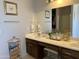 The bathroom features a double vanity, gold fixtures, and framed artwork at 21873 W Pima St, Buckeye, AZ 85326