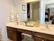 Bathroom featuring a vanity with dual sinks, a makeup counter, and tile flooring at 21873 W Pima St, Buckeye, AZ 85326