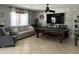 Spacious game room features a pool table, TV, and comfortable seating, perfect for entertainment at 21873 W Pima St, Buckeye, AZ 85326