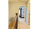 Upstairs hallway with view into bedroom and lovely natural light at 21873 W Pima St, Buckeye, AZ 85326