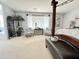 Bright bedroom featuring neutral carpet, stylish chairs, and a large window at 21873 W Pima St, Buckeye, AZ 85326
