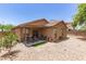 Cozy backyard featuring a patio area and gravel landscaping at 2223 S Hughes Dr, Buckeye, AZ 85326