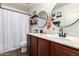 Bathroom with double mirrors, modern fixtures, and a shower at 2223 S Hughes Dr, Buckeye, AZ 85326