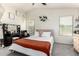 Bright bedroom with neutral tones, large window and decorative accents at 2223 S Hughes Dr, Buckeye, AZ 85326