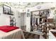 Bright bedroom featuring an organized closet, leopard accents, and natural lighting at 2223 S Hughes Dr, Buckeye, AZ 85326