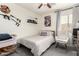 Cozy bedroom with a comfortable bed, ceiling fan, and pop culture decor at 2223 S Hughes Dr, Buckeye, AZ 85326