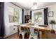 Bright dining area with a wooden table, metal chairs, and modern decor at 2223 S Hughes Dr, Buckeye, AZ 85326