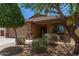 Charming single-story home featuring a two-car garage and desert landscaping at 2223 S Hughes Dr, Buckeye, AZ 85326
