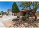 Charming single-story home featuring a two-car garage and desert landscaping at 2223 S Hughes Dr, Buckeye, AZ 85326