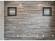 Interior shot of a modern accent wall with decorative shuttered windows and multiple electrical outlets at 2315 W Duane Ln, Phoenix, AZ 85085