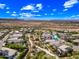Scenic aerial view of a neighborhood with desert landscaping, mountain views, and a clear blue sky at 2315 W Duane Ln, Phoenix, AZ 85085