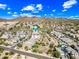 Picturesque aerial view showcasing a community nestled against a mountain backdrop with desert landscaping at 2315 W Duane Ln, Phoenix, AZ 85085