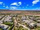 Scenic aerial view of a neighborhood with desert landscaping, mountain views, and a clear blue sky at 2315 W Duane Ln, Phoenix, AZ 85085