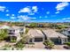 Beautiful neighborhood with well-maintained homes, lush landscaping, and tile roofs under blue skies at 2315 W Duane Ln, Phoenix, AZ 85085