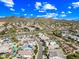 Attractive aerial view of a desert community nestled in front of a mountain range against a clear blue sky at 2315 W Duane Ln, Phoenix, AZ 85085