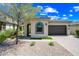 Charming home featuring desert landscaping, an arched entryway, and a two-car garage at 2315 W Duane Ln, Phoenix, AZ 85085