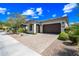 Charming home featuring desert landscaping, an arched entryway, and a two-car garage at 2315 W Duane Ln, Phoenix, AZ 85085