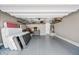 Spacious garage with epoxy flooring, overhead storage racks, and ample room for storage at 2315 W Duane Ln, Phoenix, AZ 85085