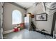 A clean garage space with epoxy floor, metal cabinets, golf clubs, and a motorcycle picture at 2315 W Duane Ln, Phoenix, AZ 85085