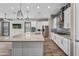 Gourmet kitchen with an island, stainless appliances, and tile backsplash at 2315 W Duane Ln, Phoenix, AZ 85085