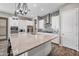 Stylish kitchen showcases a center island, stainless appliances, and eye-catching tile backsplash at 2315 W Duane Ln, Phoenix, AZ 85085