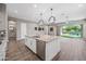 Kitchen island with granite countertop, stainless steel appliances and pendant lighting at 2315 W Duane Ln, Phoenix, AZ 85085