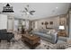 Open-concept living room showcases a gray sofa and seamless transition into the kitchen and dining areas at 2315 W Duane Ln, Phoenix, AZ 85085