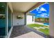 Covered patio featuring a large outdoor TV and views of the sparkling backyard pool and water feature at 2315 W Duane Ln, Phoenix, AZ 85085