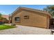 Spacious backyard featuring a playhouse, basketball hoop, artificial turf, and gravel at 23749 W Grove St, Buckeye, AZ 85326