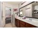Bathroom boasts a double sink vanity and access to the primary bedroom at 23749 W Grove St, Buckeye, AZ 85326